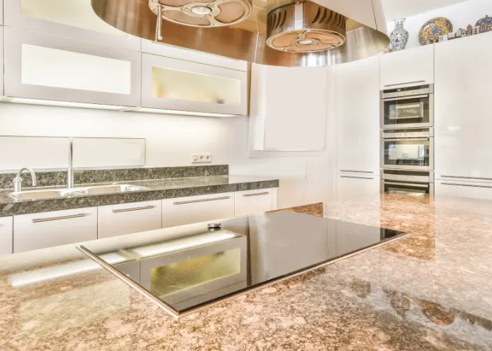 Newly remodeled kitchen with beautiful granite kitchen countertops colored of different shades of brown and tan